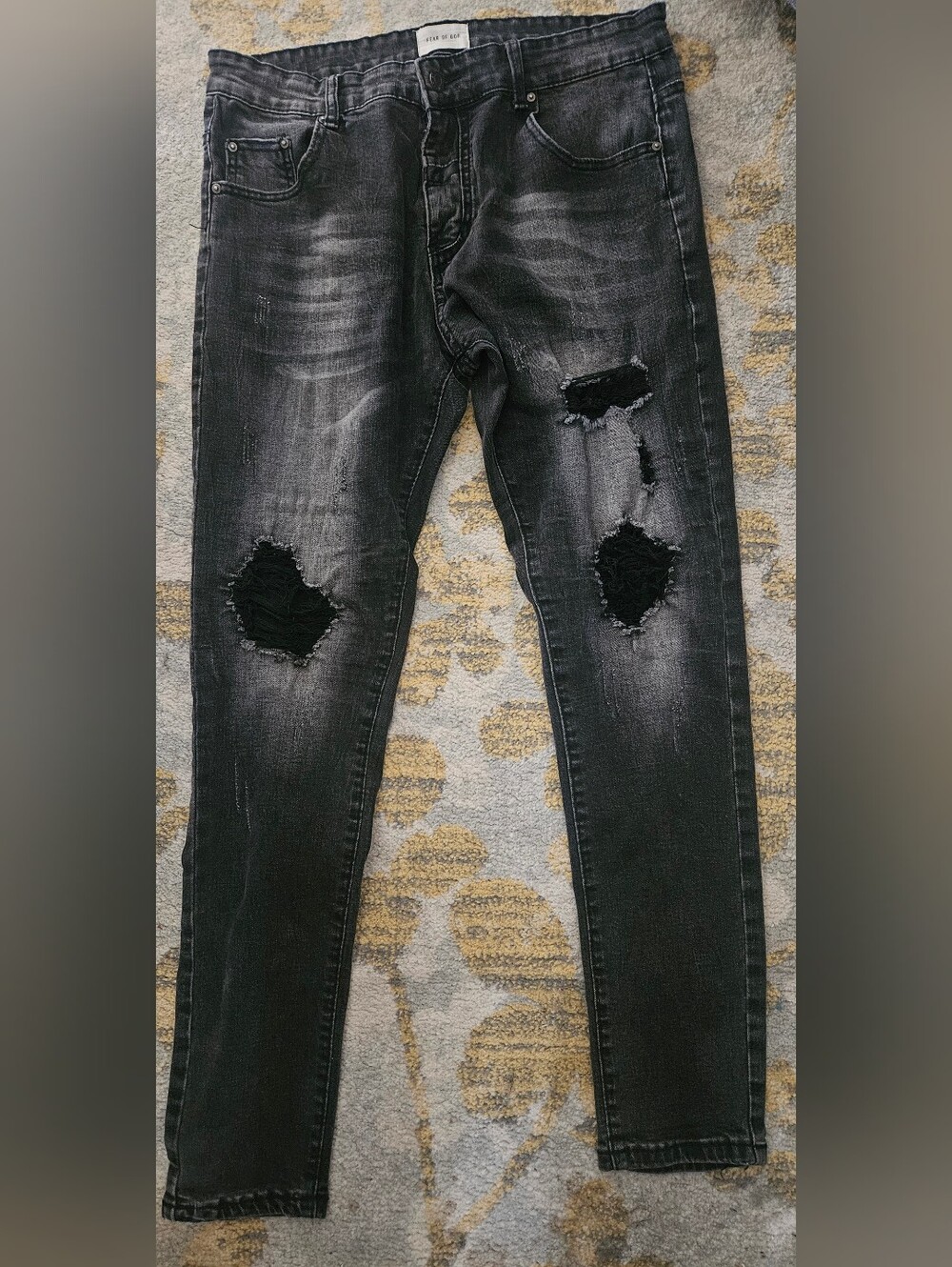 Fear of God Sixth Collection black distressed jeans. 34